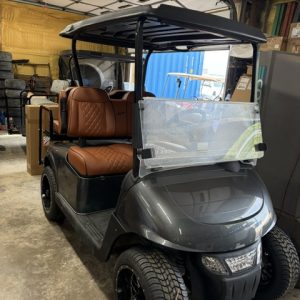 2021 ELITE CHARCOAL GRAY SHOWROOM CART HARD LOADED BUCKET SEATS, CUSTOM MARINE STEREO W/ LIGHTED KICKER SPEAKERS FACTORY LITHIUM BATTERY , BATTERY WARRANTY GOOD TILL 2029 NEW 14" MAG WHEELS W/ LOW PRO TIRES FROM EZGO ,& DELUXE LED LIGHT POD