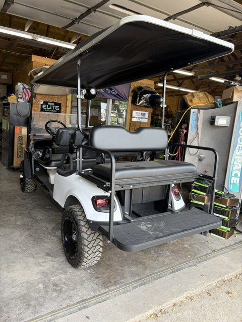 JUST FINISHED 8/21/26 WHITE 2015 CUSTOM FACTORY 6 SEATER ALL NEW BODY, TRIM, BRUSHGUARD, SEATS, MARINE STEREO W/LIGHTED KICKER SPEAKERS, 4" EZGO AXLE LIFT KIT, LIGHTS, 23" TERRAIN TIRES 8/ 6 VOLTS FOR LONGER RUN TIMES ONLY ON FACTORY 6 SEATERS - Image 6