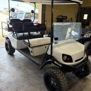95% DONE 8/19/26 WHITE 2015 CUSTOM FACTORY 6 SEATER ALL NEW BODY, TRIM, BRUSHGUARD, SEATS, MARINE STEREO W/LIGHTED KICKER SPEAKERS, 4" EZGO AXLE LIFT KIT, LIGHTS, 23" TERRAIN TIRES 8/ 6 VOLTS FOR LONGER RUN TIMES ONLY ON FACTORY 6 SEATERS