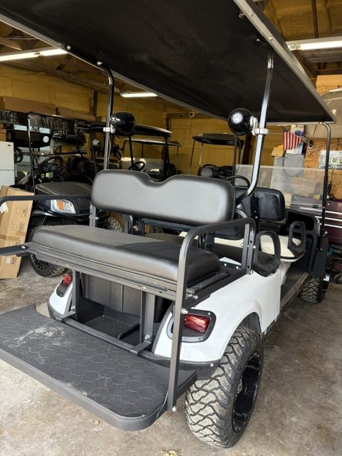 JUST FINISHED 8/21/26 WHITE 2015 CUSTOM FACTORY 6 SEATER ALL NEW BODY, TRIM, BRUSHGUARD, SEATS, MARINE STEREO W/LIGHTED KICKER SPEAKERS, 4" EZGO AXLE LIFT KIT, LIGHTS, 23" TERRAIN TIRES 8/ 6 VOLTS FOR LONGER RUN TIMES ONLY ON FACTORY 6 SEATERS - Image 2
